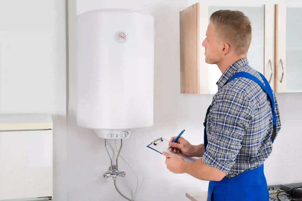 Man with a clipboard inspecting an electric boiler