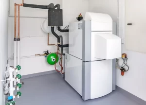 A modern heating system with a boiler, expansion tank, pipes, and safety valves installed in a clean utility room.